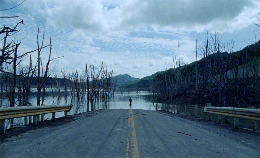 person standing at the end of a road