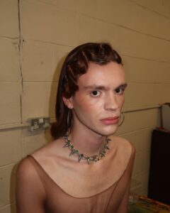 Portrait photo of Benjamin Hall against a beige background