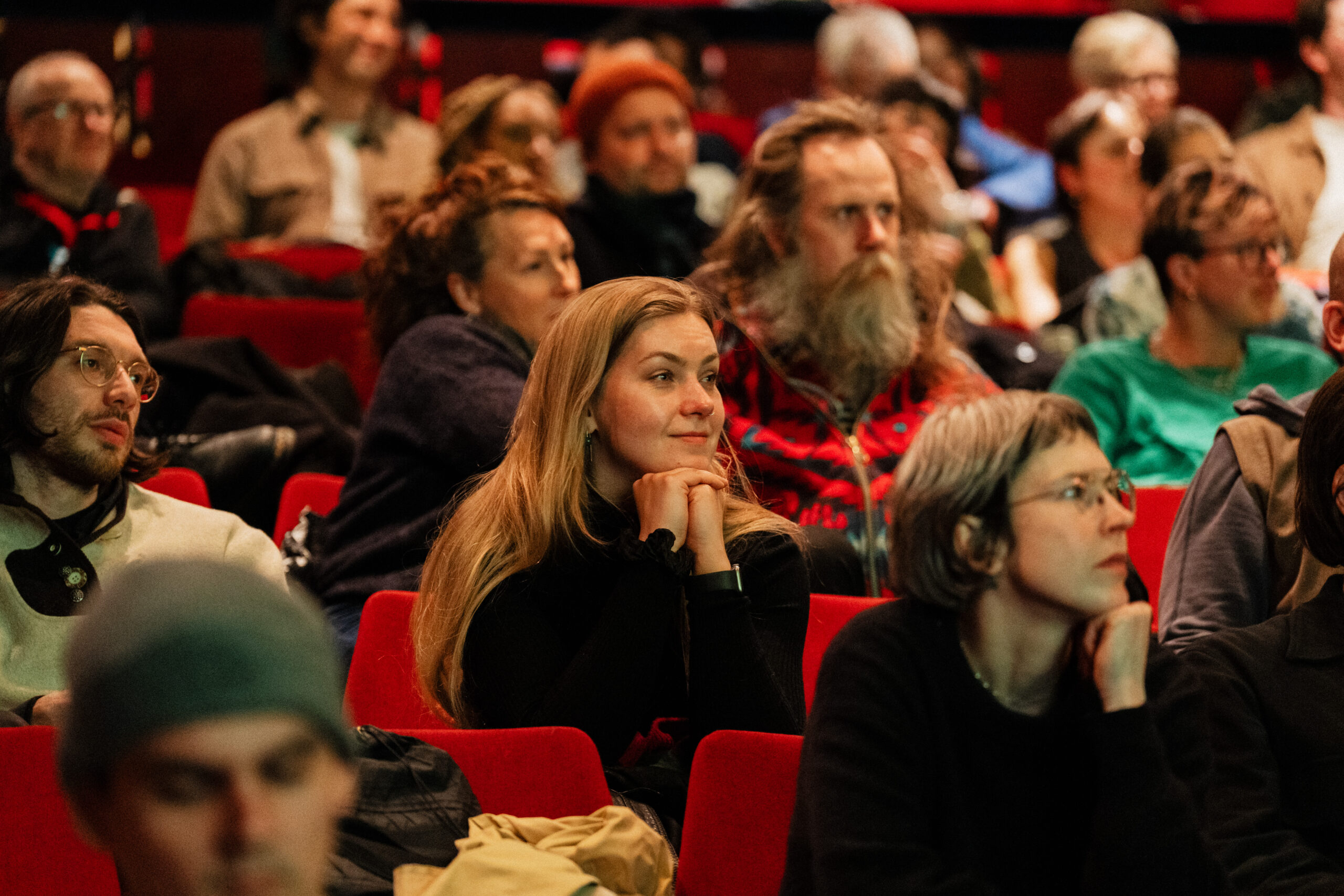 Someone watching a Q&A from a cinema audience.