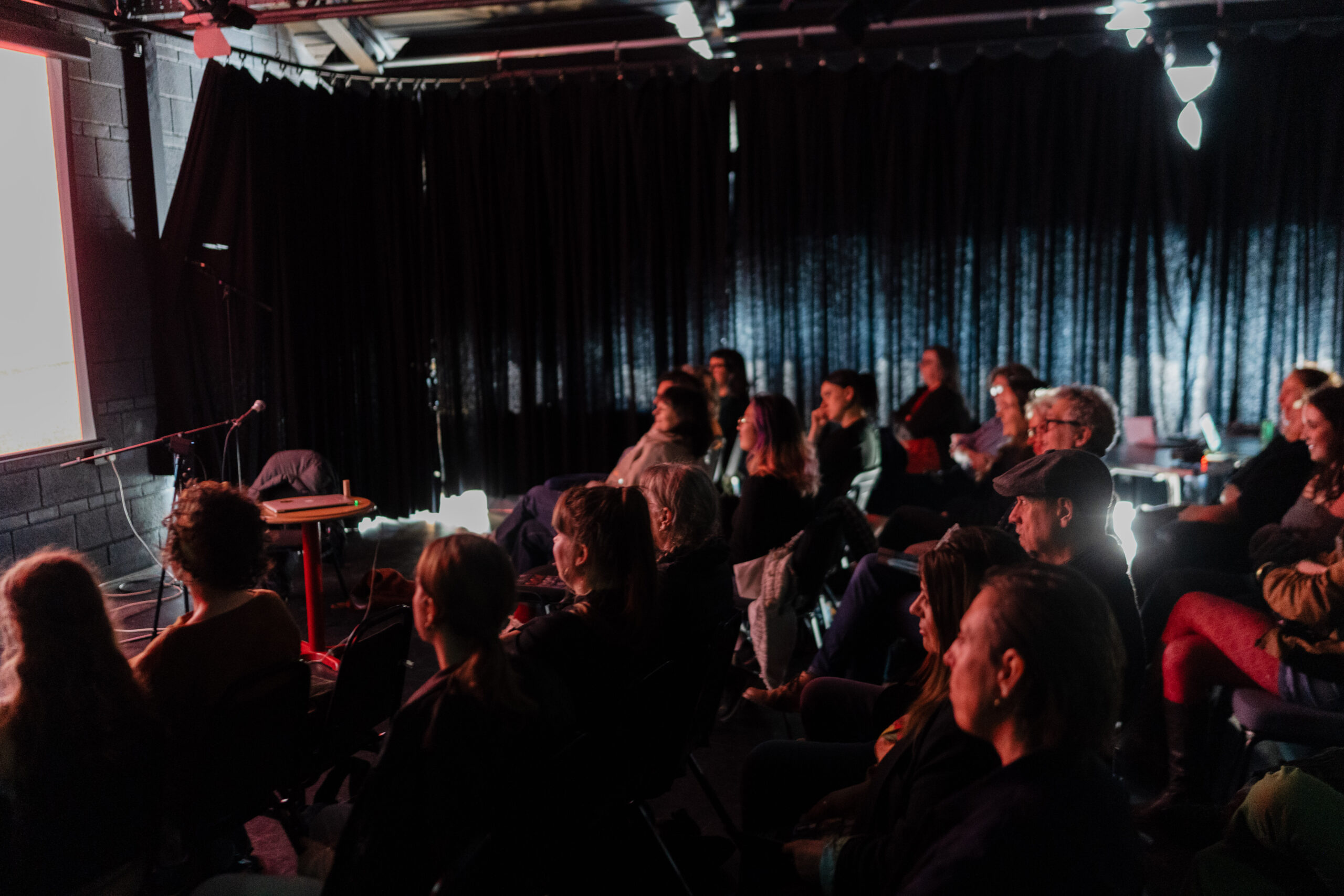 group of people in a dark room