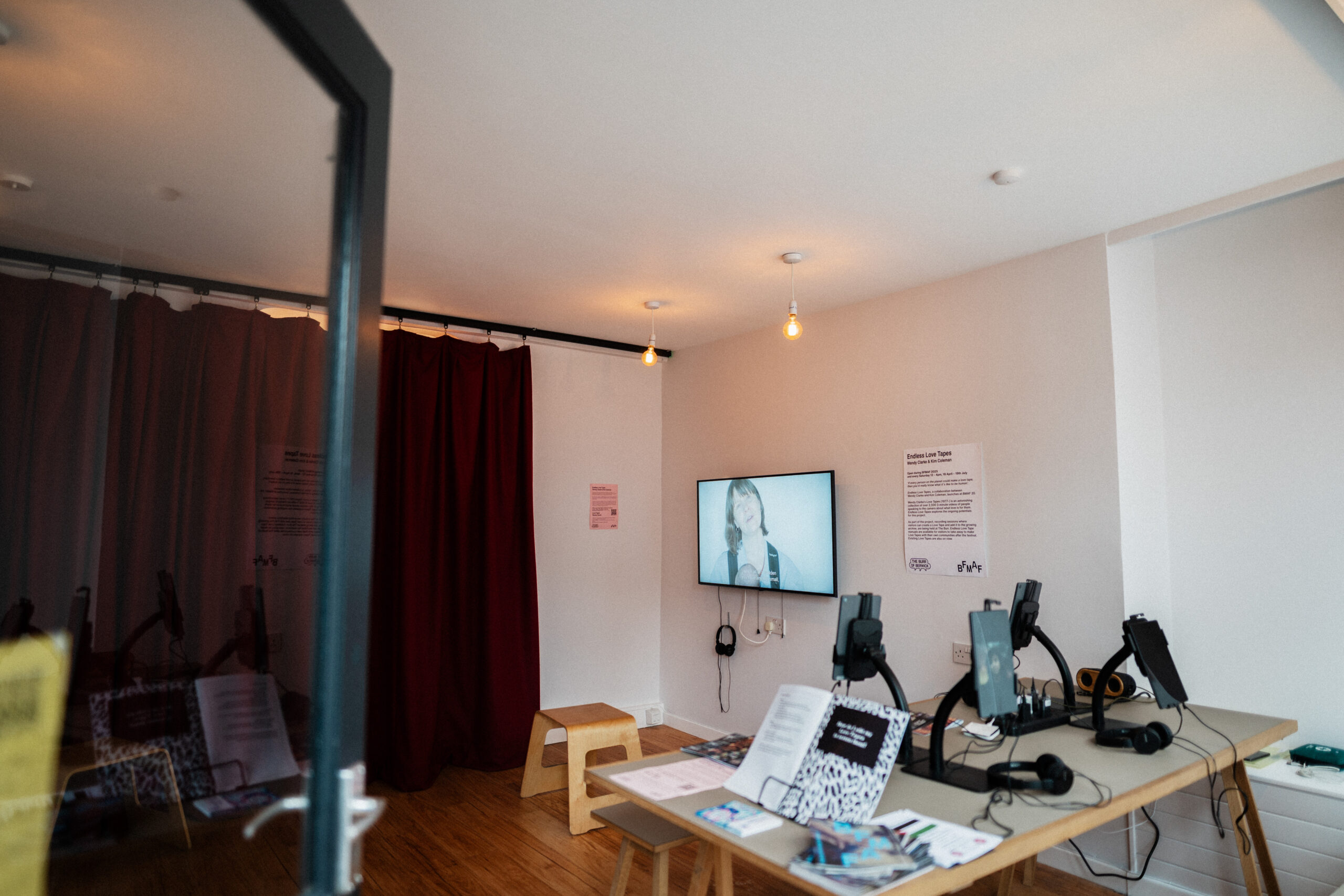 empty room with ipads and a flatscreen